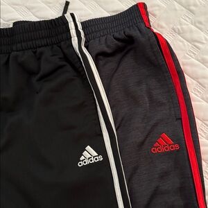 Two pairs adidas pants